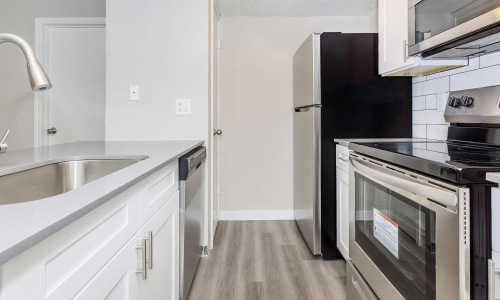 Spacious kitchens with thoughtful details c-shaped kitchen with track lighting
